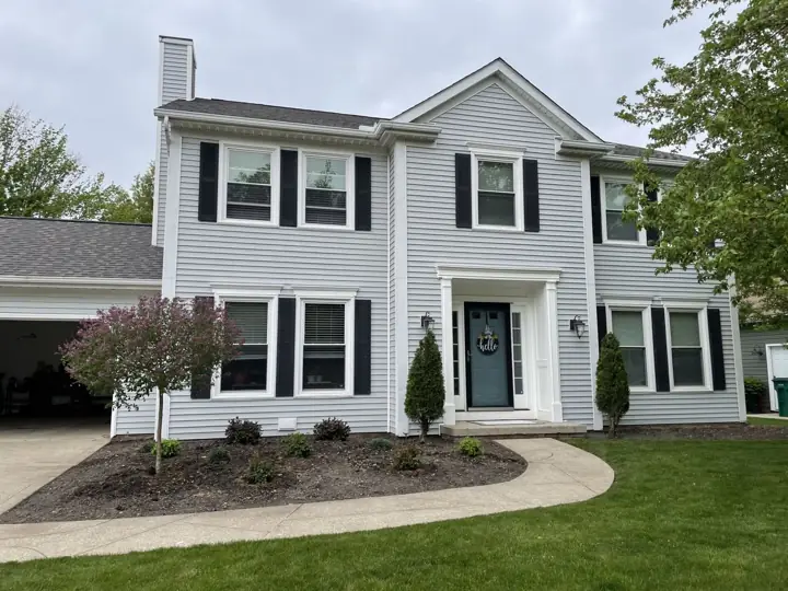 Beige siding transformation, before exterior view