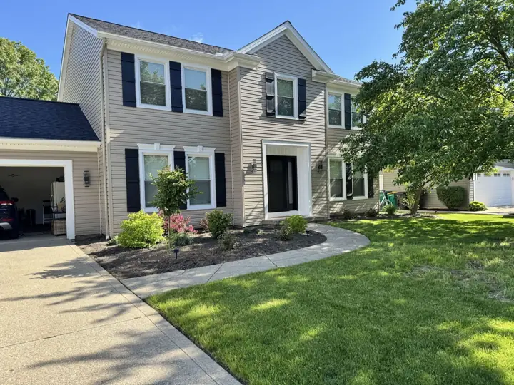Completed beige siding project by Solo Home Improvement
