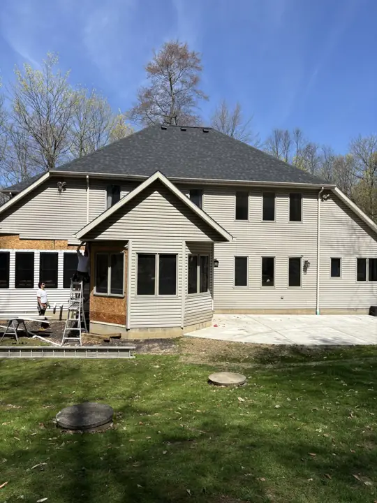 A roof with multiple intersecting slopes above an exterior project
