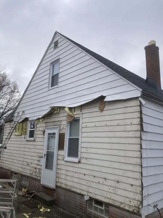 Gray siding transformation, before exterior view